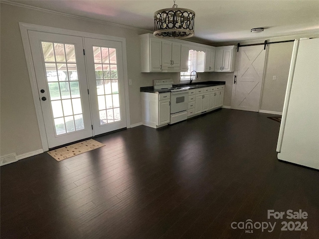 kitchen featuring white appliances, dark hardwood / wood-style flooring, sink, white cabinetry, and a barn door