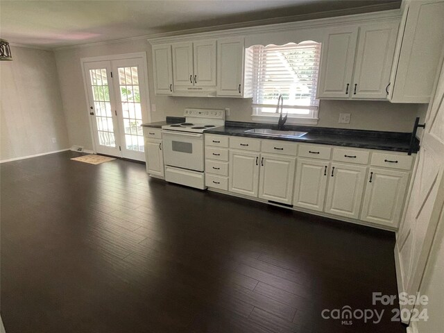 kitchen featuring dark wood-type flooring, sink, ventilation hood, white range with electric cooktop, and white cabinets