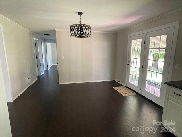 unfurnished dining area featuring crown molding and dark wood-type flooring