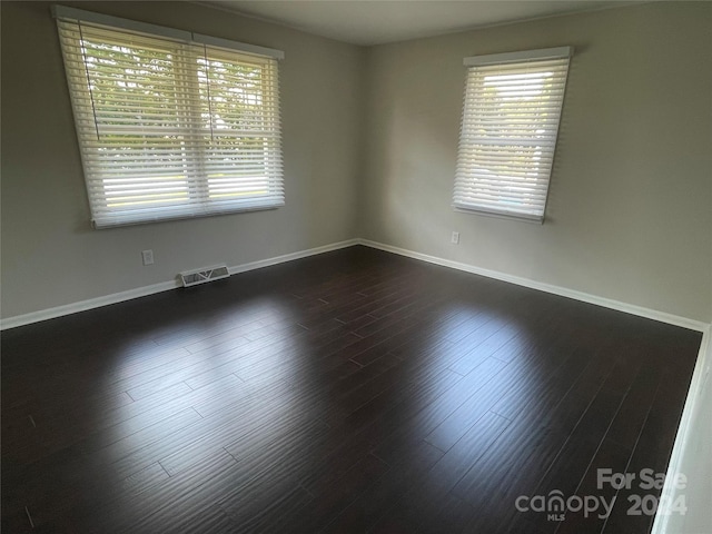 empty room featuring dark hardwood / wood-style floors