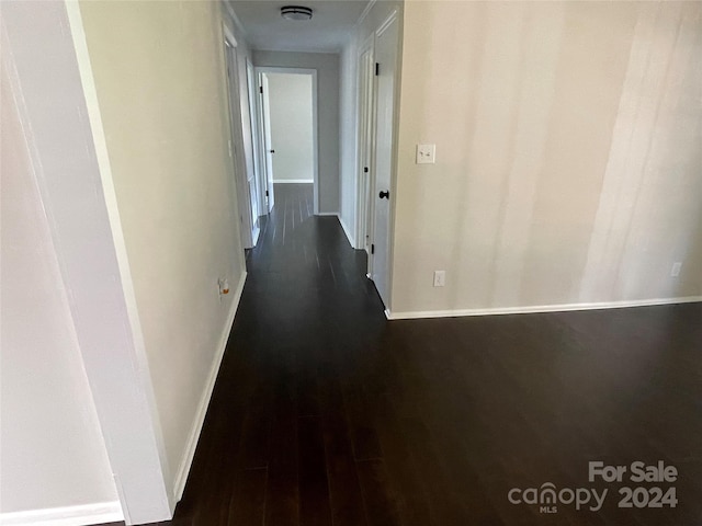 hall with dark hardwood / wood-style flooring