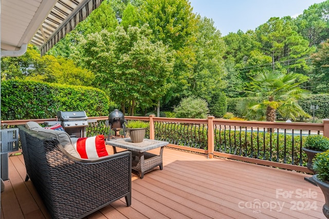 wooden terrace featuring a grill