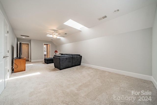 carpeted living room featuring ceiling fan and lofted ceiling