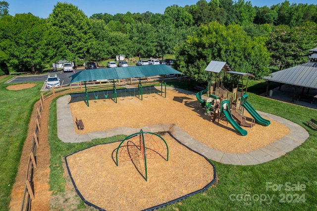 view of jungle gym featuring a lawn