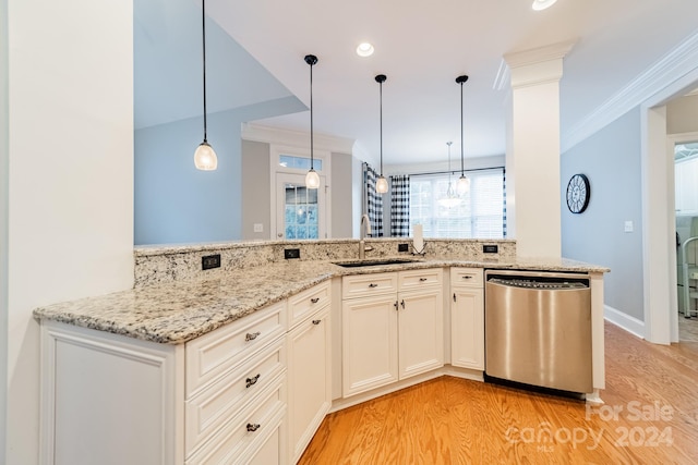 kitchen featuring dishwasher, sink, light hardwood / wood-style flooring, kitchen peninsula, and decorative light fixtures