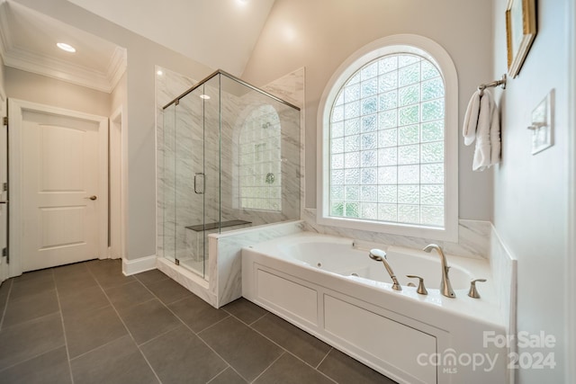 bathroom featuring tile patterned flooring, vaulted ceiling, a wealth of natural light, and crown molding