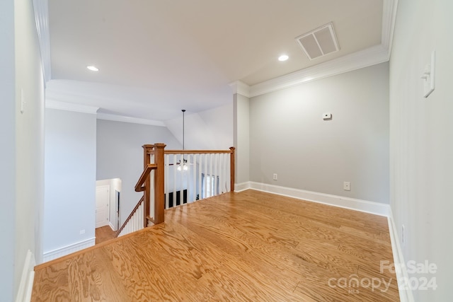 interior space with crown molding and wood-type flooring