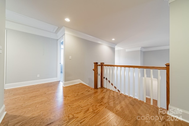 interior space with crown molding and light hardwood / wood-style flooring