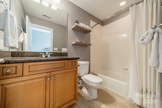 full bathroom with tile patterned floors, vanity, shower / bath combination with curtain, and toilet