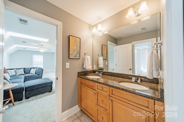 bathroom with tile patterned floors, ceiling fan, and vanity