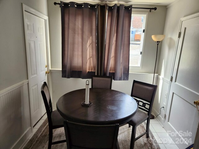 dining area with light tile patterned floors