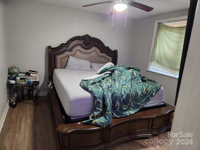 bedroom with ceiling fan and hardwood / wood-style flooring