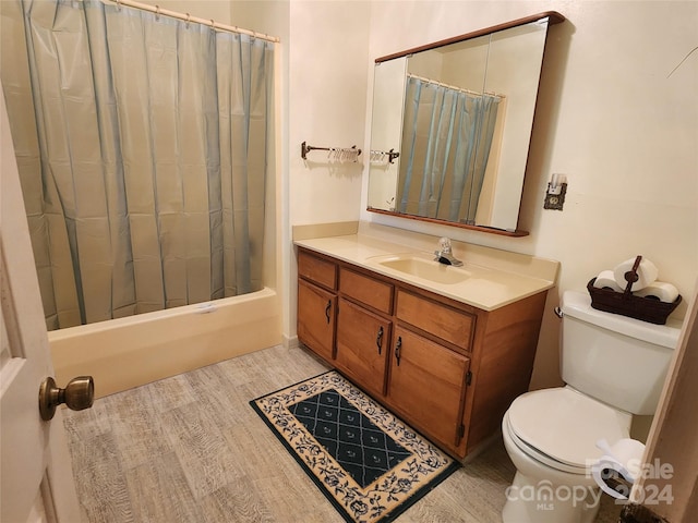 bathroom featuring toilet, vanity, and shower / bath combo