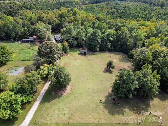 birds eye view of property with a rural view