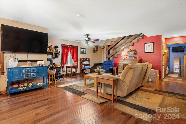 living room with ceiling fan and hardwood / wood-style flooring