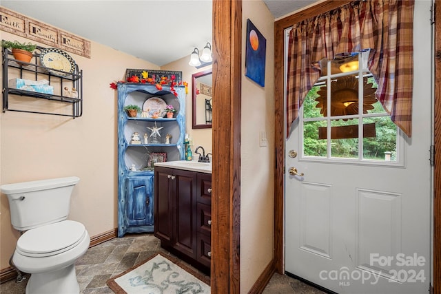 bathroom with toilet and vanity