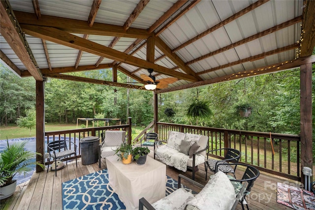 wooden terrace featuring ceiling fan and outdoor lounge area