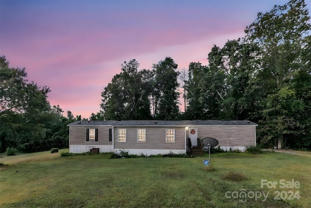 manufactured / mobile home with a lawn