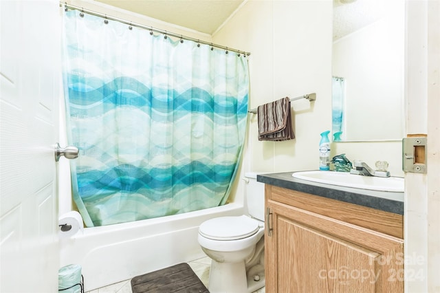 full bathroom with tile patterned flooring, shower / bathtub combination with curtain, toilet, vanity, and a textured ceiling