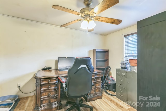 office with ceiling fan and light hardwood / wood-style floors