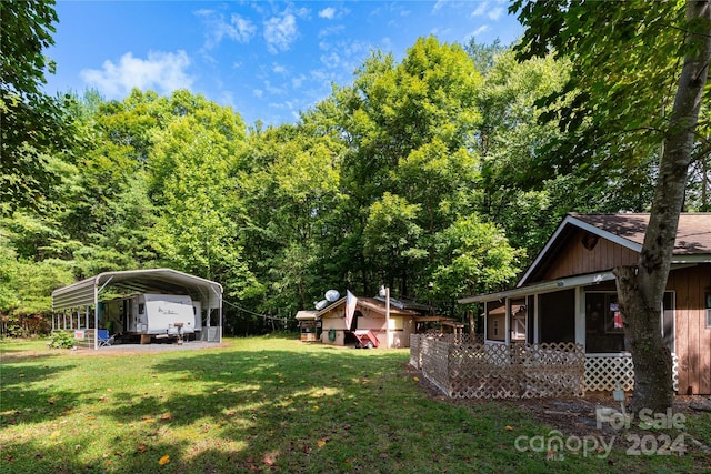 view of yard with a carport