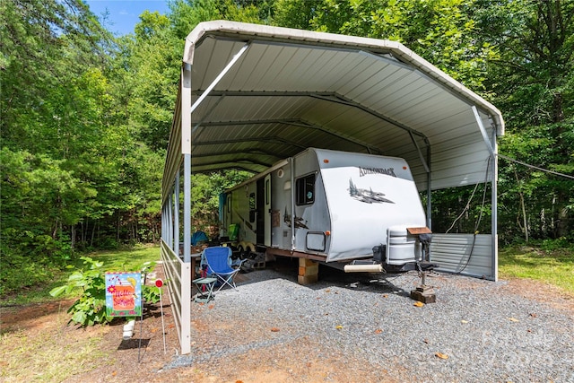 view of parking / parking lot featuring a carport