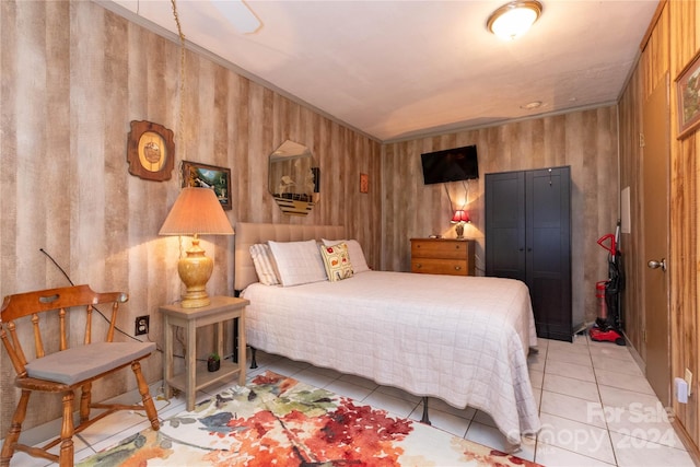 bedroom with light tile patterned floors