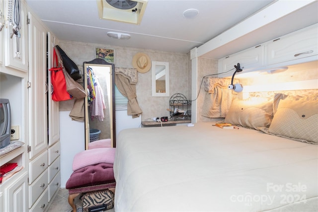 bedroom featuring light tile patterned floors