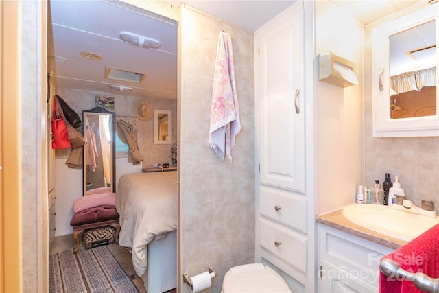 bathroom with vanity and toilet