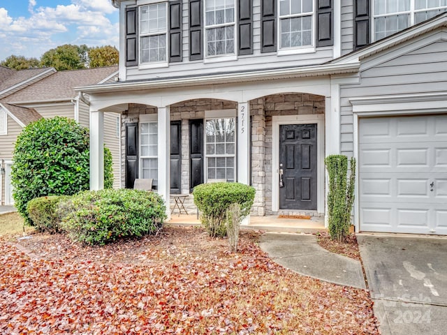 entrance to property featuring covered porch