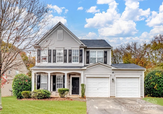 view of front of home featuring a garage and a front yard