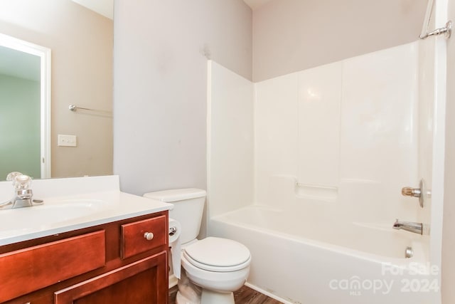 full bathroom with vanity, toilet,  shower combination, and hardwood / wood-style flooring