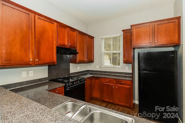 kitchen featuring black appliances and sink