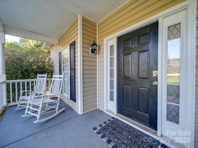 doorway to property featuring a porch