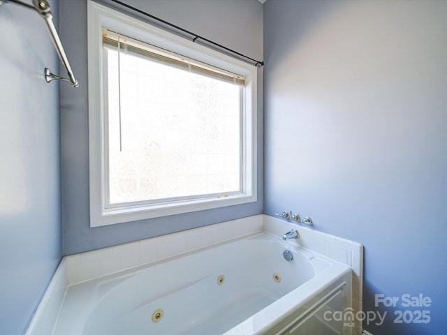 bathroom featuring a tub to relax in