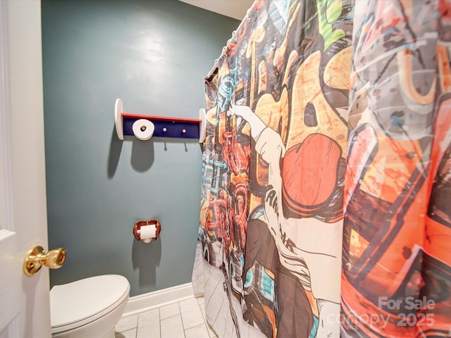 bathroom with tile patterned floors and toilet