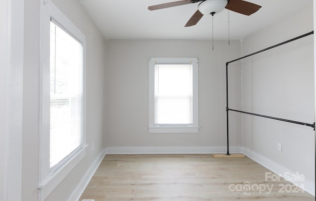 unfurnished room with ceiling fan and light hardwood / wood-style flooring