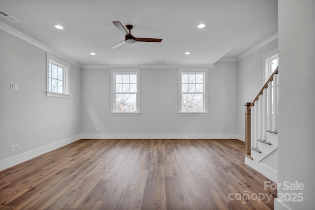 unfurnished room with ceiling fan, crown molding, and hardwood / wood-style floors