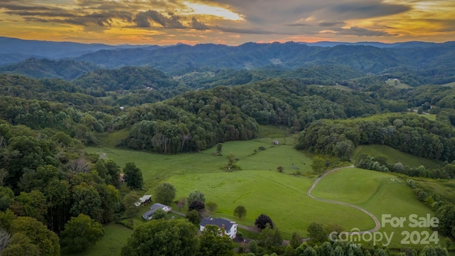 aerial view at dusk with a mountain view