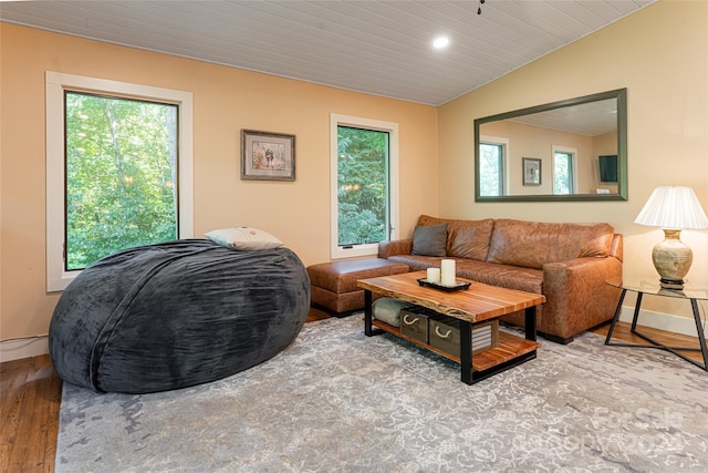 living room featuring hardwood / wood-style flooring, lofted ceiling, and wooden ceiling