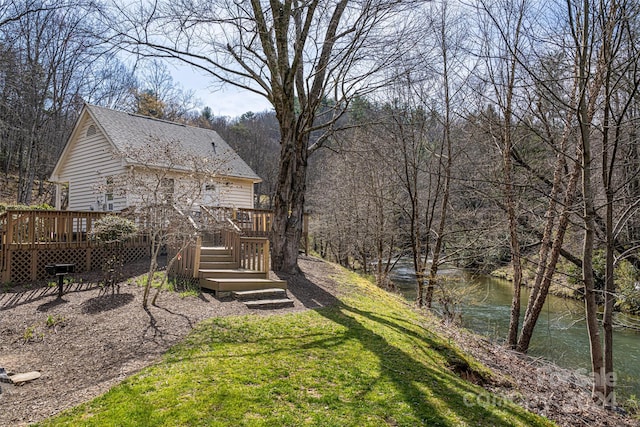 view of yard featuring a wooden deck