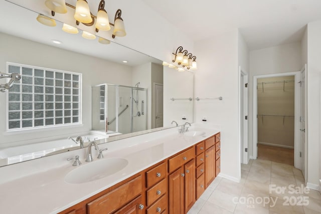 bathroom with an enclosed shower, tile patterned floors, and vanity