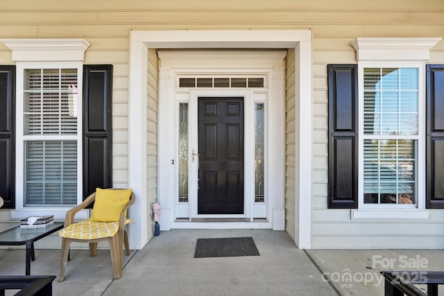 doorway to property featuring covered porch