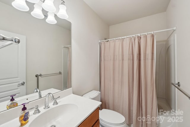 bathroom with toilet, a shower with shower curtain, and vanity