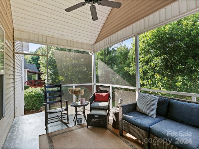 sunroom featuring wood ceiling, lofted ceiling, and ceiling fan