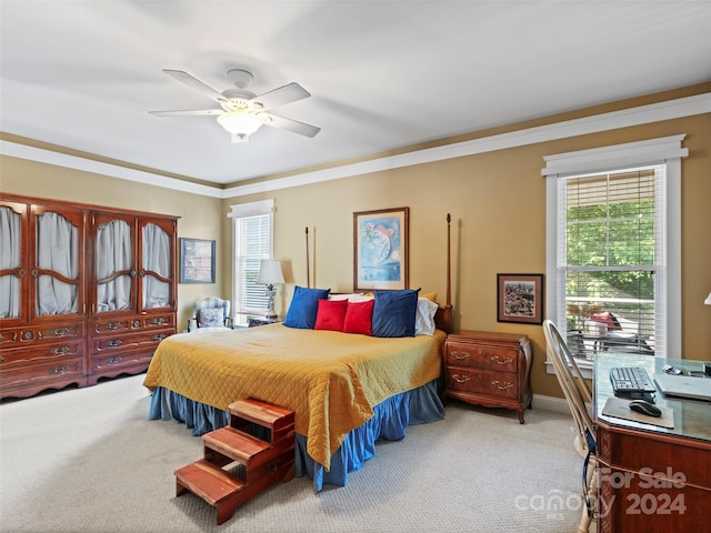 bedroom featuring ceiling fan, light colored carpet, and crown molding