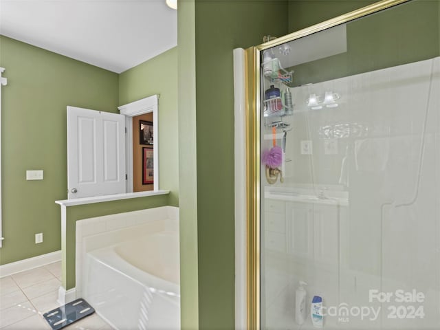 bathroom featuring plus walk in shower and tile patterned floors