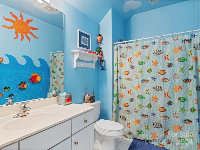 bathroom with a shower with shower curtain, tile patterned flooring, vanity, and toilet