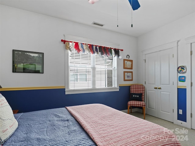 carpeted bedroom with ceiling fan