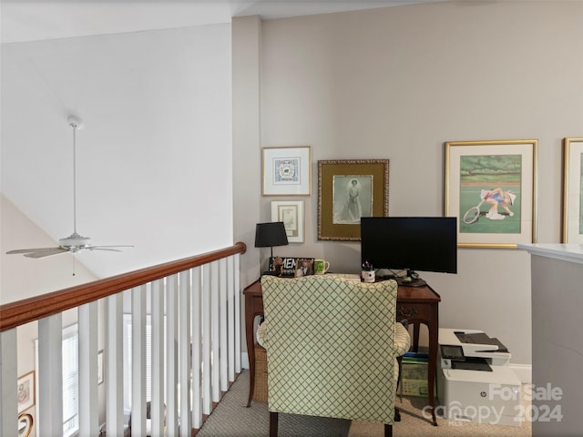 office area with ceiling fan and carpet